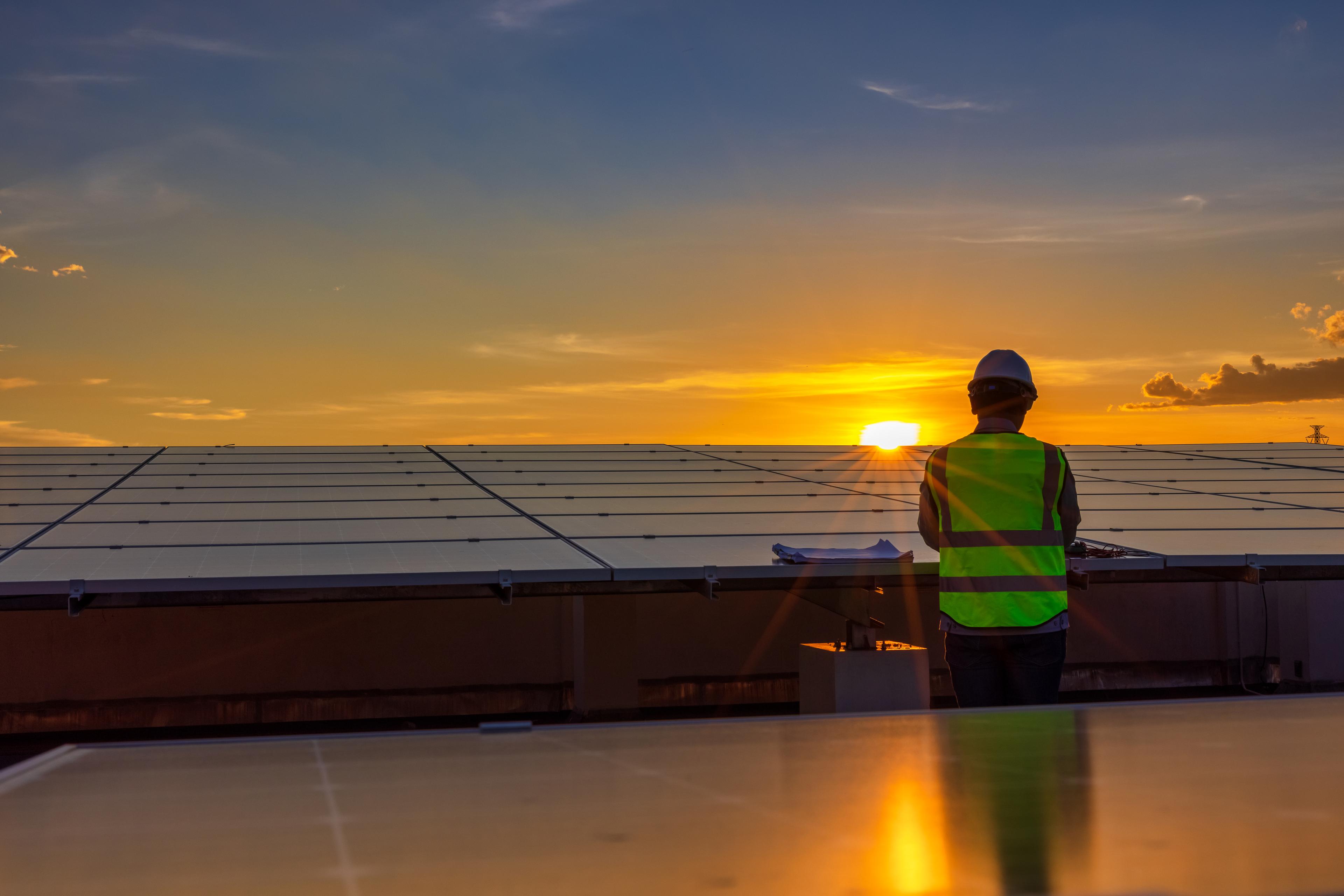 Man working on solar panels